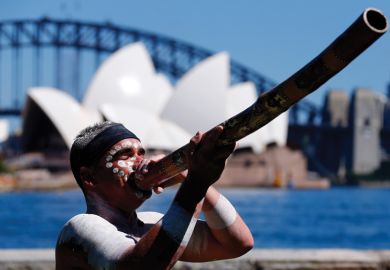 Aboriginal man plays didgeridoo, Sydney Opera House, Australia