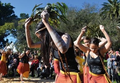Indigenous Australian performers hold a smoking ceremony 