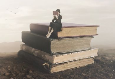 A little person on a pile of books