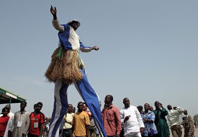 A participant on stilts performs during the Abuja Cultural Carnival in Nigeria. To illustrate Africa rising in the World University Rankings A participant on stilts performs during the Abuja Cultural Carnival in Nigeria. To illustrate Africa rising in the World University Rankings