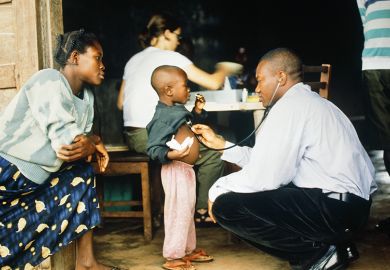 Doctor examines young patient