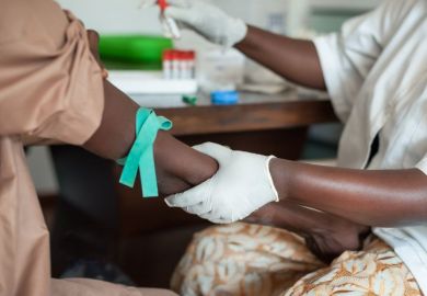 Nurse taking blood in Africa  Nurse taking blood in Africa
