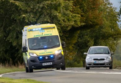 Ambulance overtakes a car