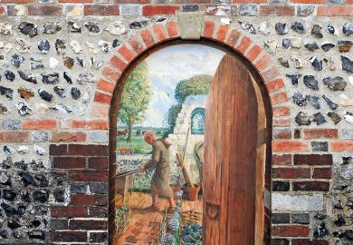 An open door with a painting behind it