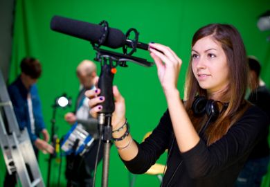 Apprentice journalist with microphone