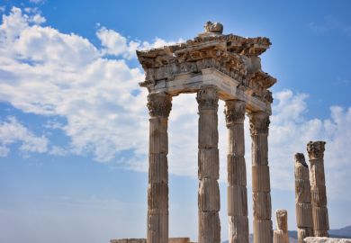 Archaeological structures, ancient columns and sites with nice clear sky. Temple of Trajan in the ancient city of Pergamon, Bergama, Turkey