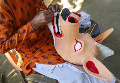 Artisan crafting the famous traditional masks of Majuli, Assam, India