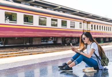 Asian tourist teenage girl at train station