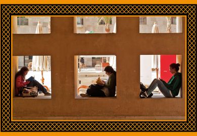 Students sitting on wall, American University in Cairo, Egypt