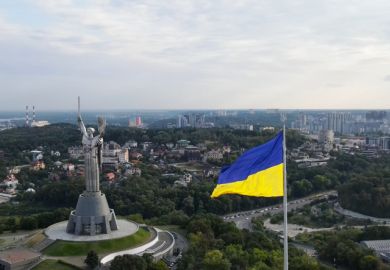 Aug-2021, Kiev, Ukraine  An aerial view of Kiev and the Motherland Monument in Kyiv (Kiev), Ukraine. Ukraine flag