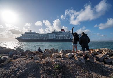 People waving off a luxury cruise ship as it leaves Adelaide, Australia. To illustrate the growing divide between rich universities and poorer ones. People waving off a luxury cruise ship as it leaves Adelaide, Australia. To illustrate the growing divide between rich universities and poorer ones.