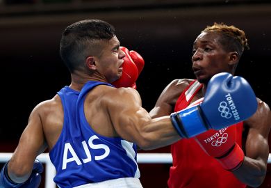 Patrick Chinyemba (R) of Zambia exchanges punches with Alex Winwood of Australia, boxing at the Tokyo 2020 Olympic Games. To illustrate that Australian universities face a bruising election. Patrick Chinyemba (R) of Zambia exchanges punches with Alex Winwood of Australia, boxing at the Tokyo 2020 Olympic Games. To illustrate that Australian universities face a bruising election.