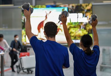 Passengers being greeted from a Singapore Airlines flight as they arrive into the terminal at Sydney Airport on 21 November 2021 in Sydney, Australia. To illustrate the new government being urged to treat overseas students with more compassion.