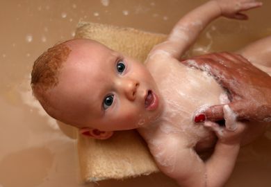 A baby being bathed