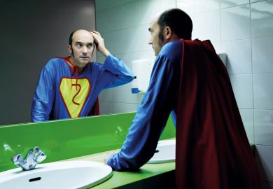Balding superhero checking hair in mirror