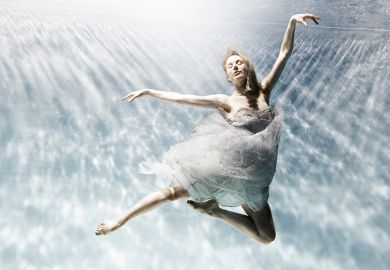 Woman making ballet pose underwater, illustrating that new REF rules ‘risk leaving researchers’ careers in limbo’