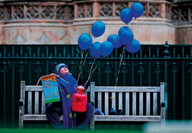 An anti-Brexit activist holds EU-flag-themed balloons outside of the Houses of Parliament in 2019 An anti-Brexit activist holds EU-flag-themed balloons outside of the Houses of Parliament in 2019 illustrating rise in university fees for EU students in England
