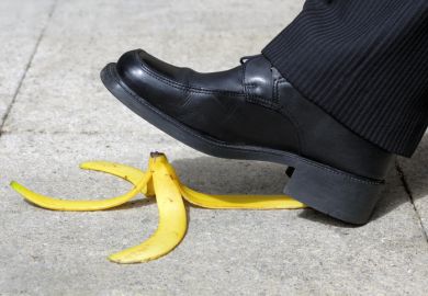 A suited man about to step on a banana peel, illustrating the threat to UK diplomacy posed by language department closures A suited man about to step on a banana peel, illustrating the threat to UK diplomacy posed by language department closures