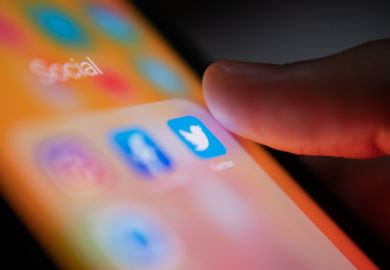 Bangkok, Thailand - July 14, 2019  iPhone user touching Twitter logo on iPhone screen to open the app.