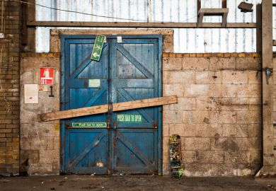 A barred door in a warehouse