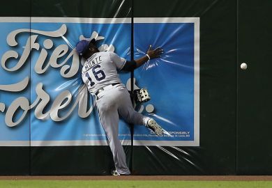 Baseball player running into wall trying to catch ball Baseball player running into wall trying to catch ball