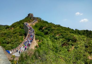 Beijing, China - July 25, 2019. People are climbing the Great Wall in China