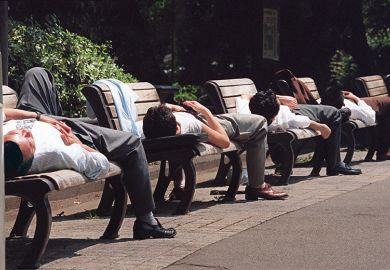 Men sleeping on benches