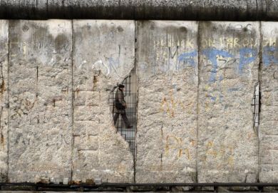 Berlin wall with hole in it