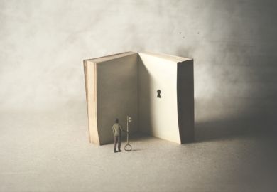 A man with a key faces a book with a keyhole A man with a key faces a book with a keyhole
