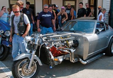 Hybrid motorcycle car to illustrate merging of college systems in USA Hybrid motorcycle car