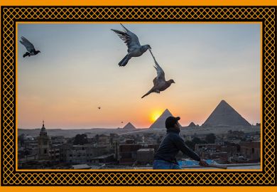 A man releases pigeons backdropped by the Giza pyramids in Egypt. To illustrate the rising of Egyptian universities in the Arab University Rankings 2024