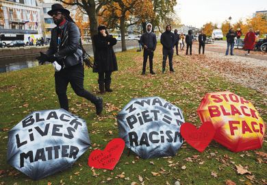 Human rights activists attend a rally against blackface characters during the Saint Nicholas parade in The Hague, Netherlands, 2019 Human rights activists attend a rally against blackface characters during the Saint Nicholas parade in The Hague, Netherlands, 2019