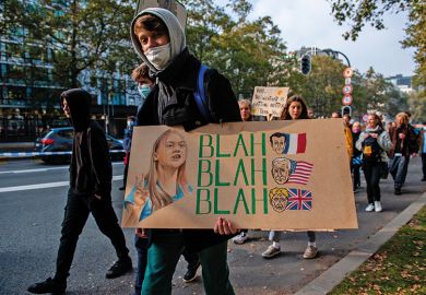 Person with placard with Greta Thunberg’s blah blah blah quote  Person with placard with Greta Thunberg’s blah blah blah quote