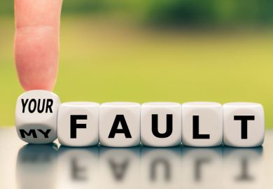 A finger turns a dice and changes the expression "my fault" to "your fault"