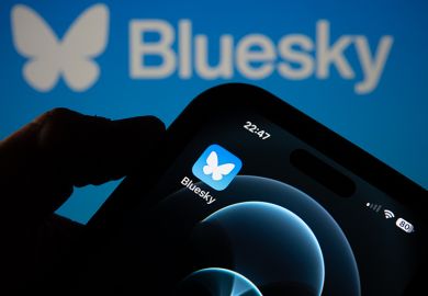 Photo illustration a smartphone screen displaying the logo of social media app Bluesky