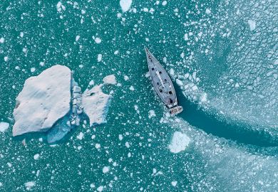 Boat changing course to avoid iceberg, illustrating scientific course correction.