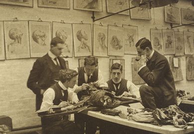 The interior of a dissecting room: five students and/or teachers dissect a cadaver