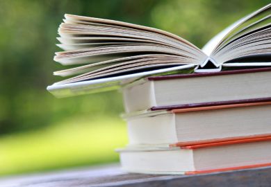 Books open on table outside