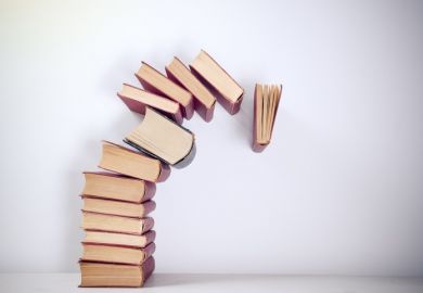 Pile of books falling over