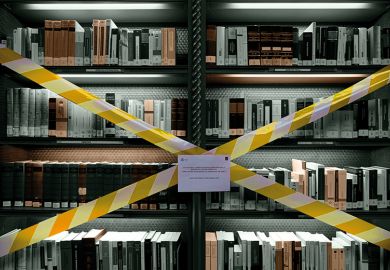 Books on taped-off library shelf