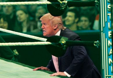 Trump next to a wrestling ring 