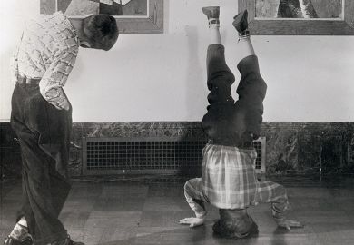 Boy standing on his head