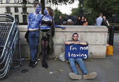 A young couple painted as EU flags protest on outside Downing Street against the United Kingdom's decision to leave the EU following the referendum A young couple painted as EU flags protest on outside Downing Street against the United Kingdom's decision to leave the EU following the referendum
