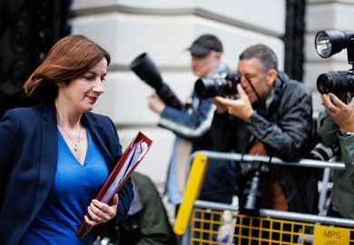 Bridget Phillipson walking past a group of photographers. To illustrate that cool heads are needed by ministers when considering considering further regulation of university franchise partnerships, which are under the spotlight.
