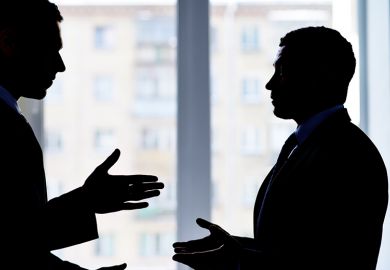 2 people having a dispute in an office. To illustrate bullying at UKRI.