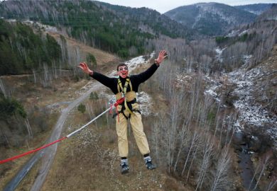 Bungee jumper yelling while leaping