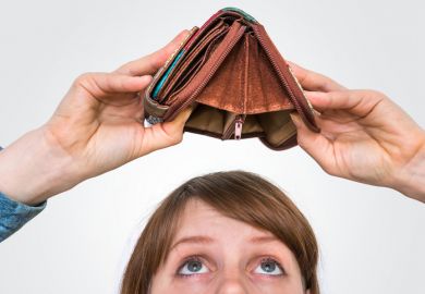 Business woman holding an empty wallet, she hasn't money