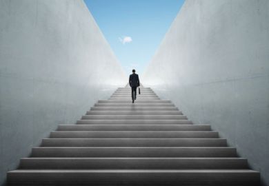 Businessman climbing stairs
