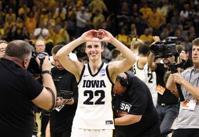 Caitlin Clark gestures to the crowd Caitlin Clark #22 of the Iowa Hawkeyes gestures to the crowd as she leaves the court after the game against the West Virginia Mountaineers during their second round match-up in the 2024 NCAA Division 1 Women's Basketball Championship