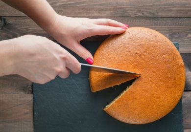 Cake being cut equally Cake being cut equally